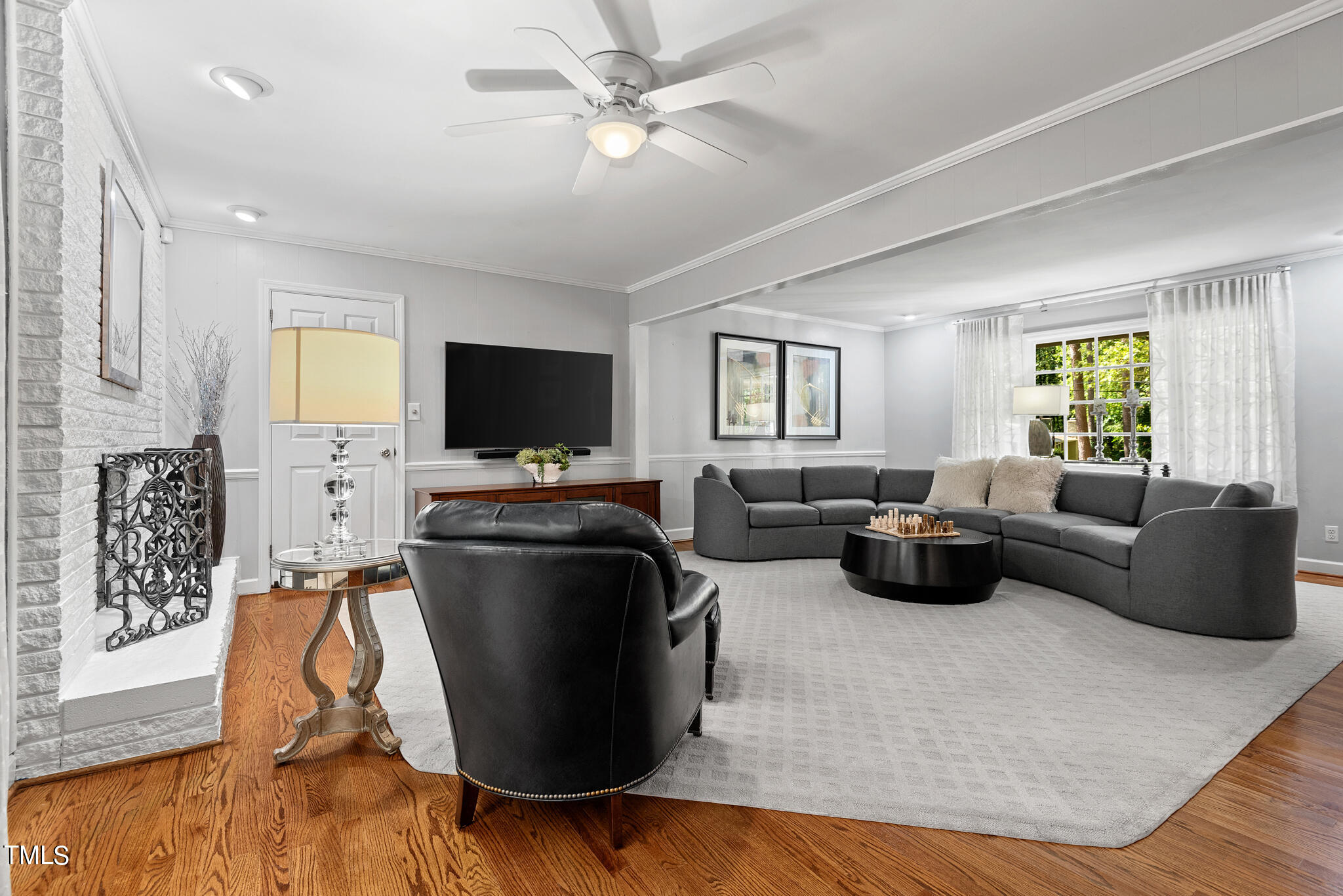 3404 Oates Drive Raleigh, NC 27604 - Photo 8 of 43 a living room with furniture and a flat screen tv