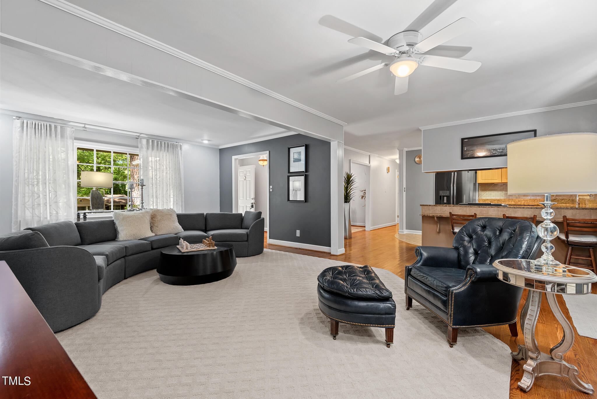 3404 Oates Drive Raleigh, NC 27604 - Photo 9 of 43 a living room with furniture ceiling fan and a window