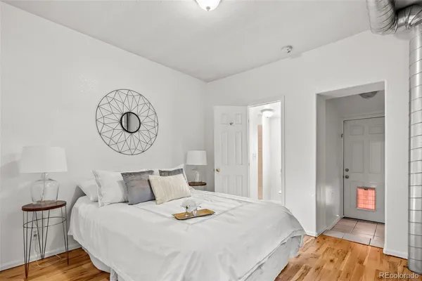 a bed room with a bed and a lamp