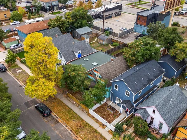 an aerial view of residential house with outdoor space and swimming pool