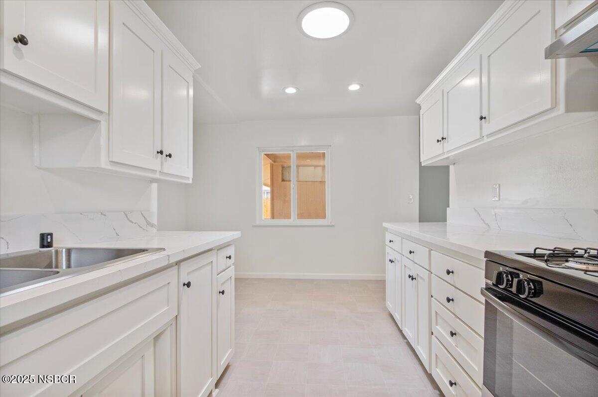 3446 Rucker Road Lompoc, CA 93436 - Photo 19 of 26 a kitchen that has a sink and a stove
