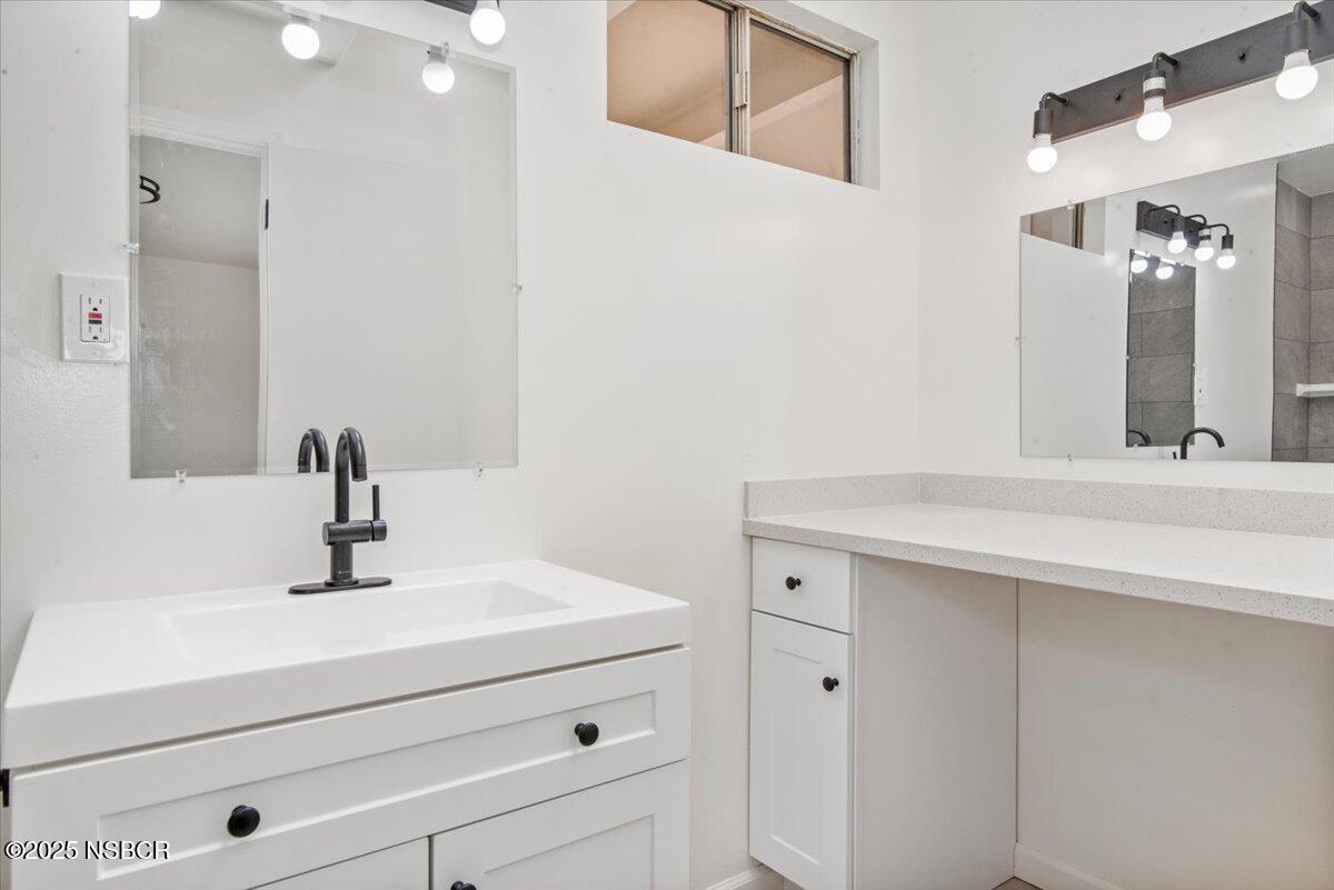 3446 Rucker Road Lompoc, CA 93436 - Photo 21 of 26 a bathroom with a sink and a mirror