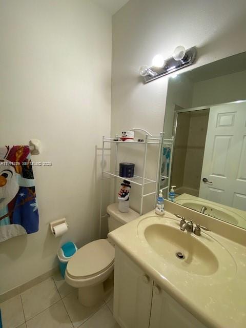 4920 Southwest 140th Terrace, Unit 4 Miramar, FL 33027 - Photo 15 of 15 a bathroom with a sink a toilet and mirror