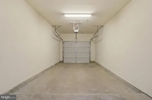 a view of room that has a white walls