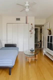 a living room with hard wood floors