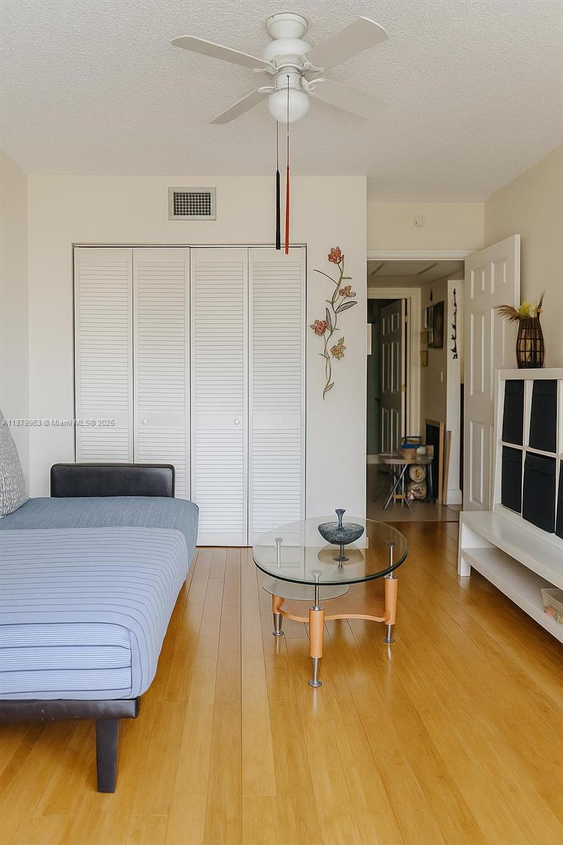 13781 Southwest 66th Street, Unit 221B Miami, FL 33183 - Photo 5 of 16 a living room with hard wood floors