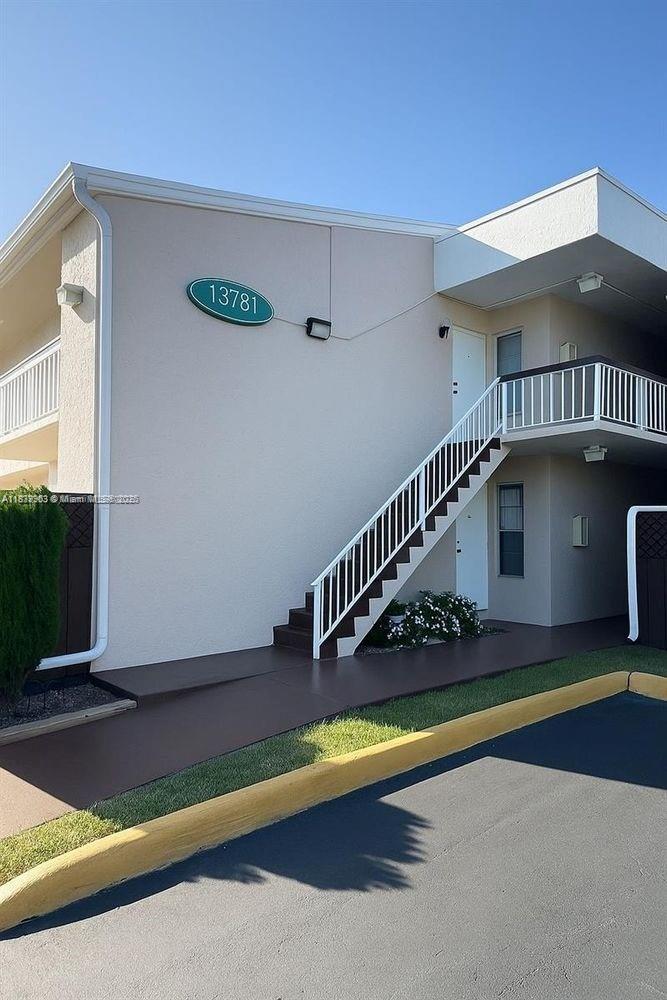 13781 Southwest 66th Street, Unit 221B Miami, FL 33183 - Photo 9 of 16 a view of swimming pool with yard in front of it