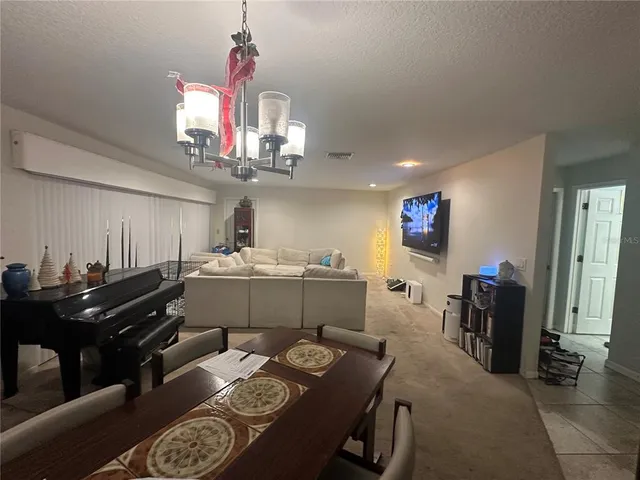a kitchen view of a dining table chairs and entryway