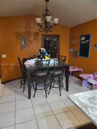 a kitchen with a sink and a stove top oven