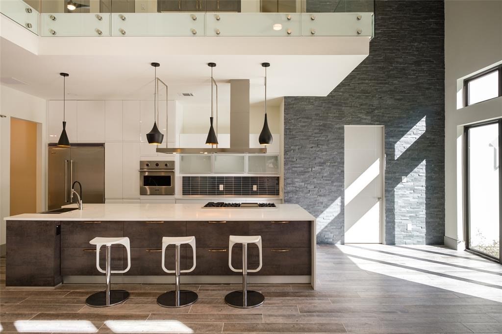 2214 Hewitt Drive Houston, TX 77018 - Photo 4 of 7 a kitchen with stainless steel appliances granite countertop a sink and a stove