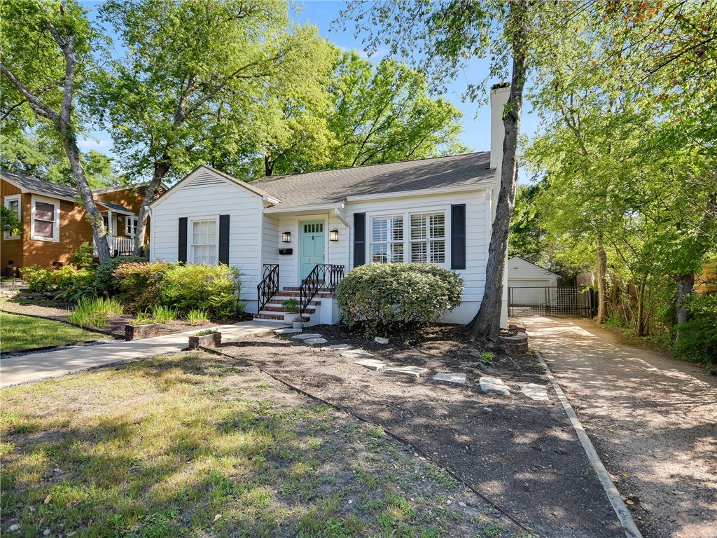 1707 Northwood Road Austin, TX 78703 - Photo 1 of 1 a view of a house with a yard and large trees