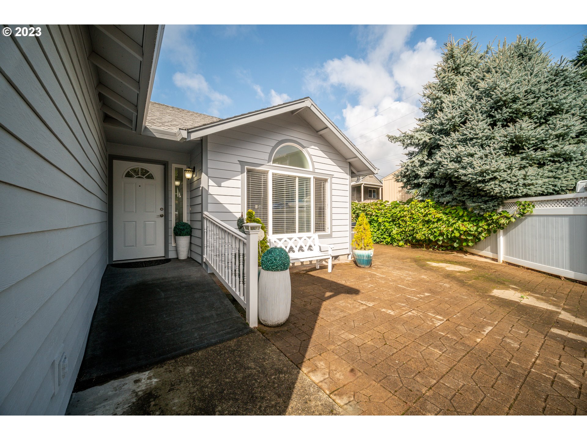 Undisclosed Address Vancouver, WA 98665 - Photo 2 of 16 a front view of a house with garden