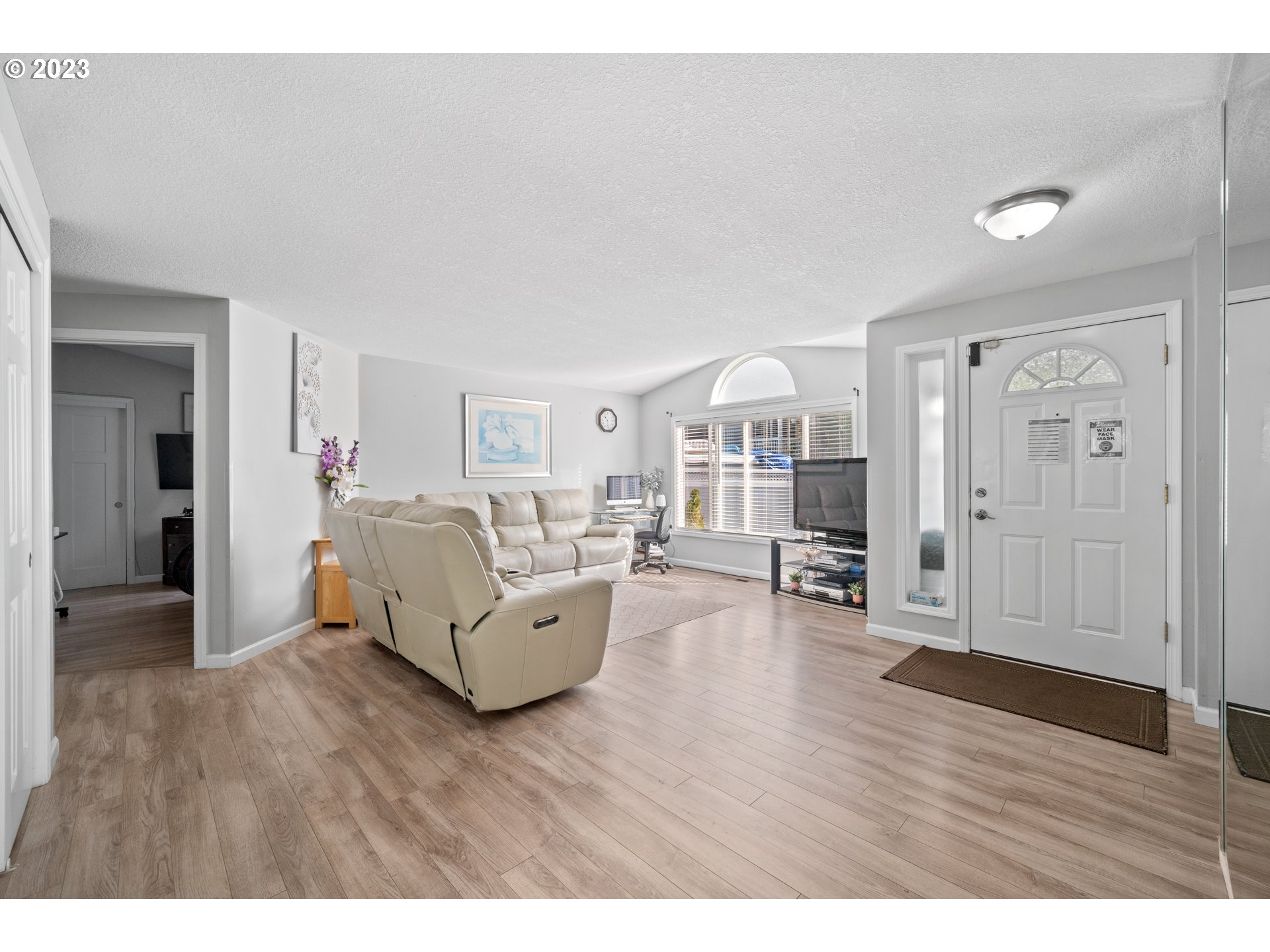 Undisclosed Address Vancouver, WA 98665 - Photo 3 of 16 a living room with furniture and a wooden floor