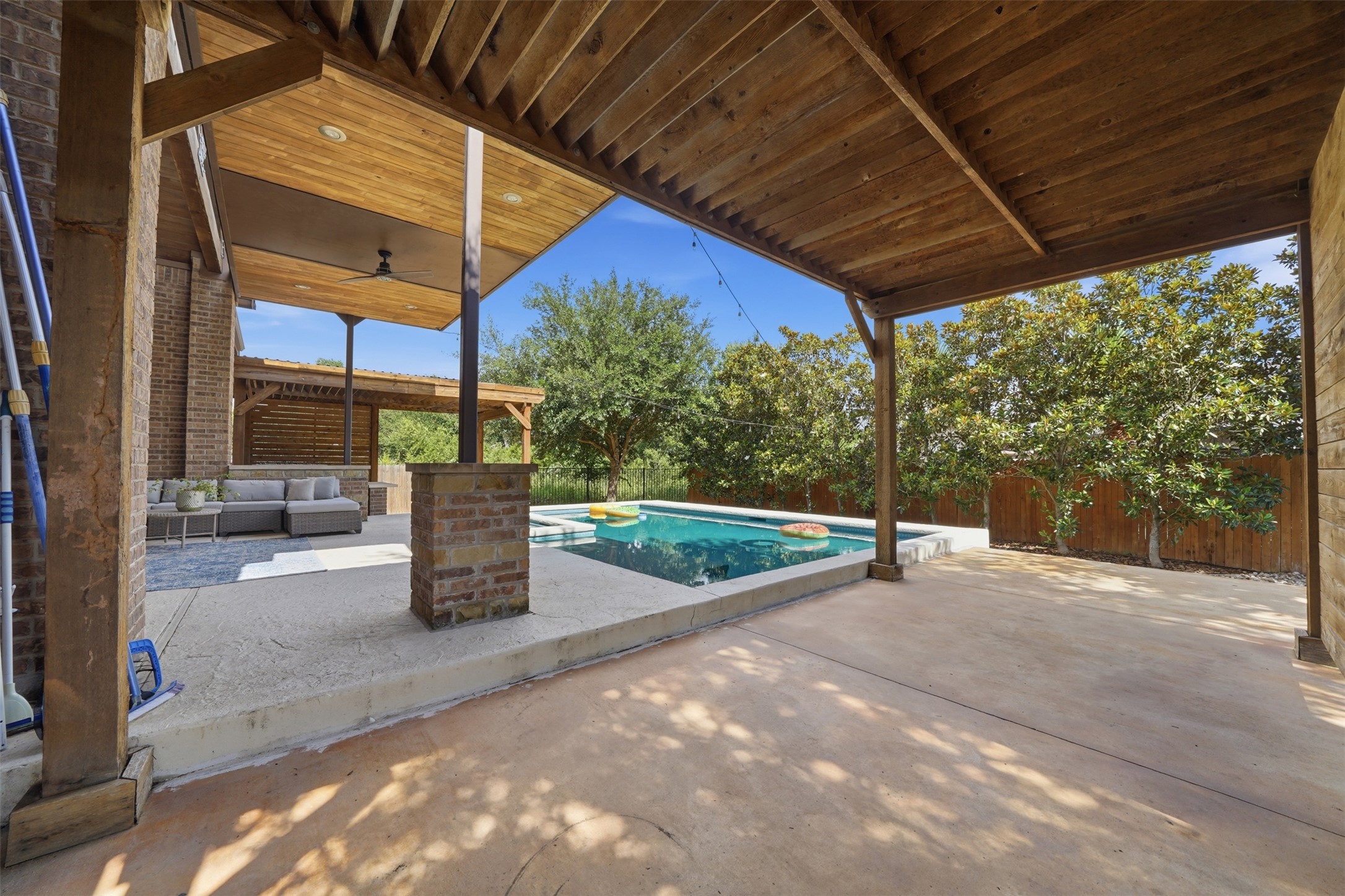 8729 Vantage Point Drive Austin, TX 78737 - Photo 23 of 33 An inviting outdoor oasis with a sparkling pool and shaded lounging areas awaits.