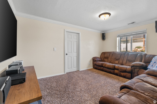5727 South 3550th Street West Roy, UT 84067 - Photo 27 of 49 Spacious room featuring neutral painted walls, crown molding, a patterned carpet, and a window with horizontal blinds