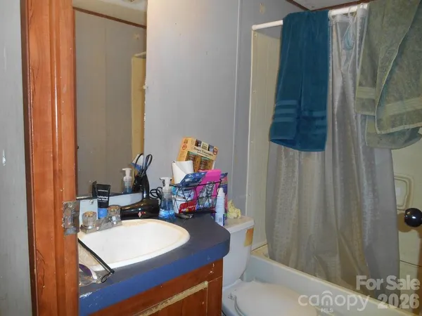 a bedroom with a bed and a table