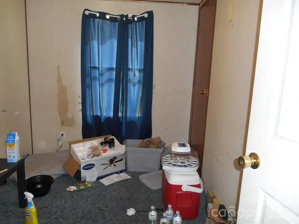 a bathroom with a sink toilet and a mirror