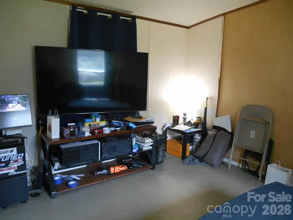 a room with furniture and a flat screen tv