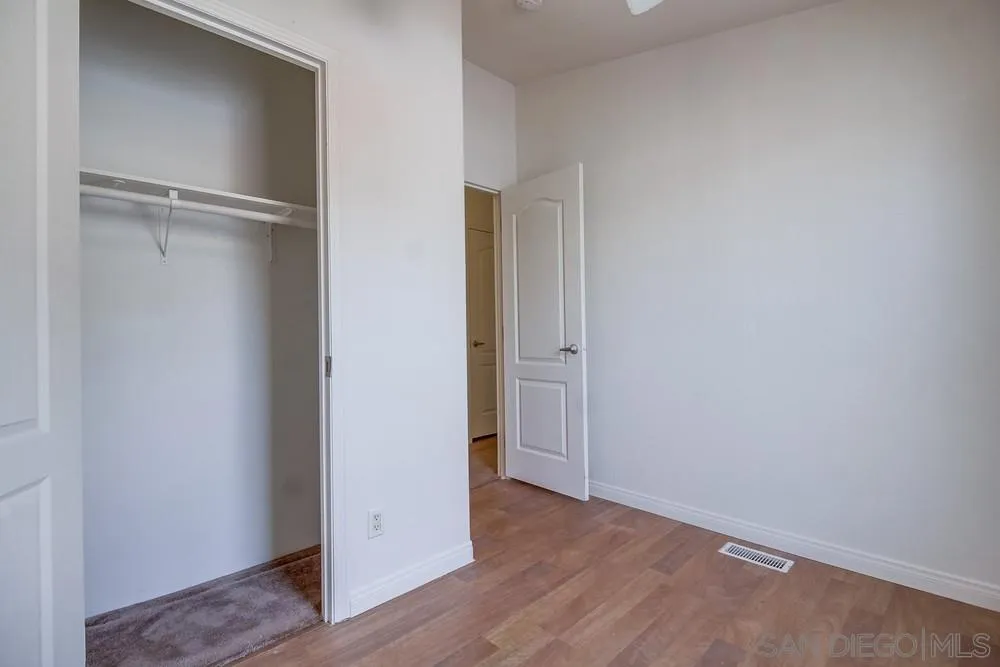 9902 Jamacha Boulevard, Unit 102 Spring Valley, CA 91977 - Photo 12 of 17 a view of an empty room with wooden floor