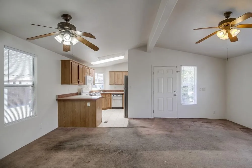 9902 Jamacha Boulevard, Unit 102 Spring Valley, CA 91977 - Photo 7 of 17 a view of kitchen and hall with a window