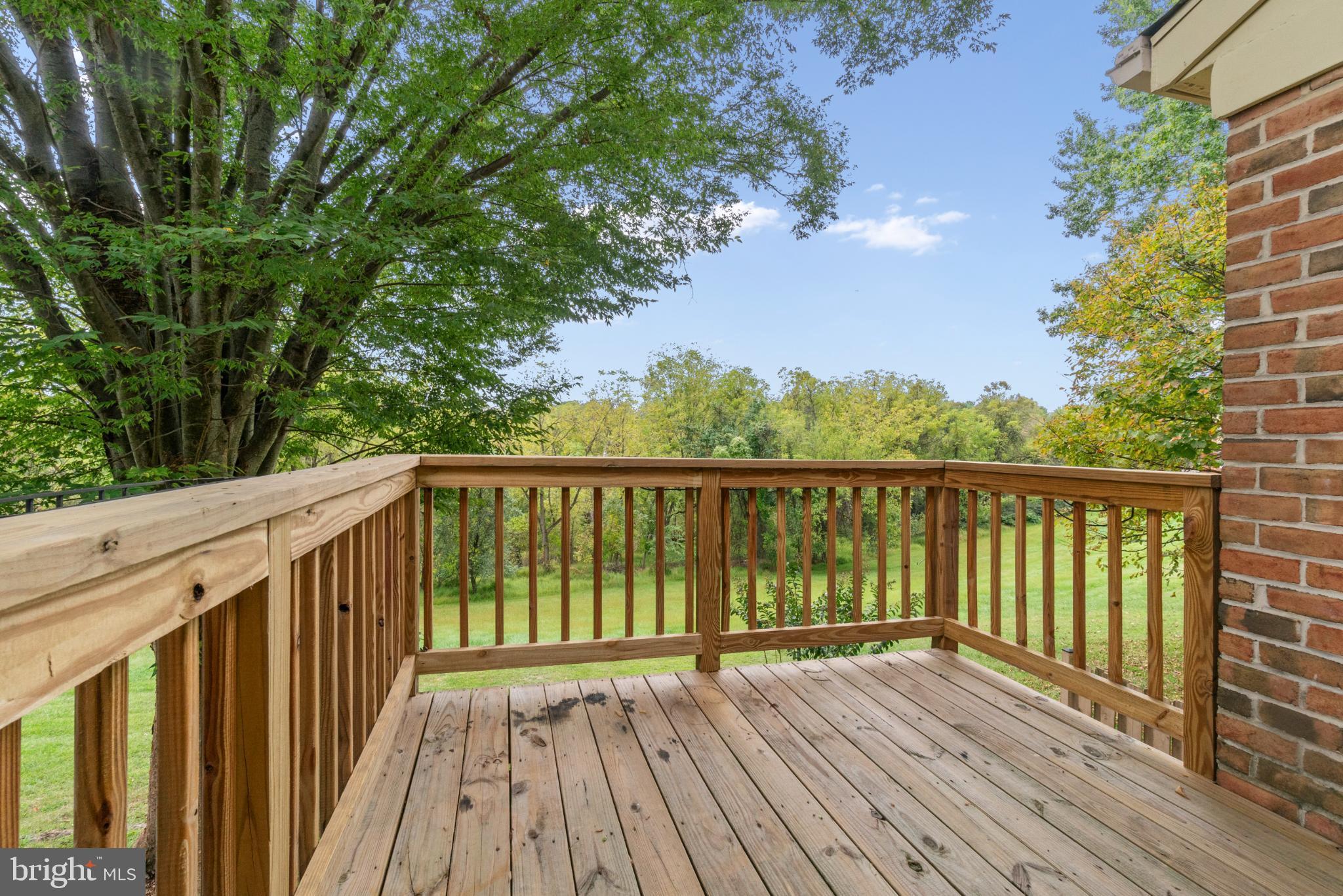 146 English Run Circle Sparks, MD 21152 - Photo 18 of 37 Serene deck overlooking lush greenery.