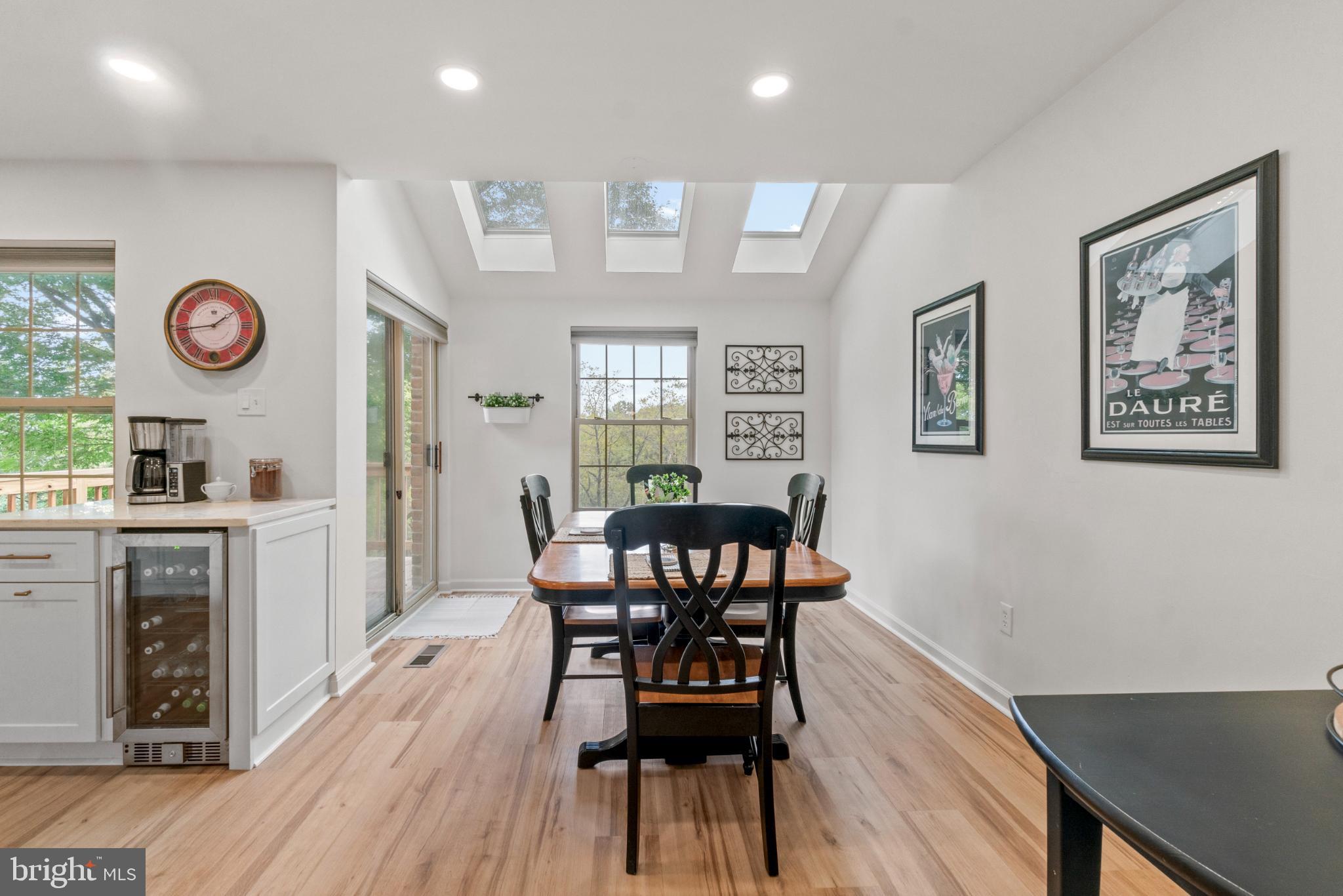 146 English Run Circle Sparks, MD 21152 - Photo 9 of 37 Bright and airy dining space with skylights.