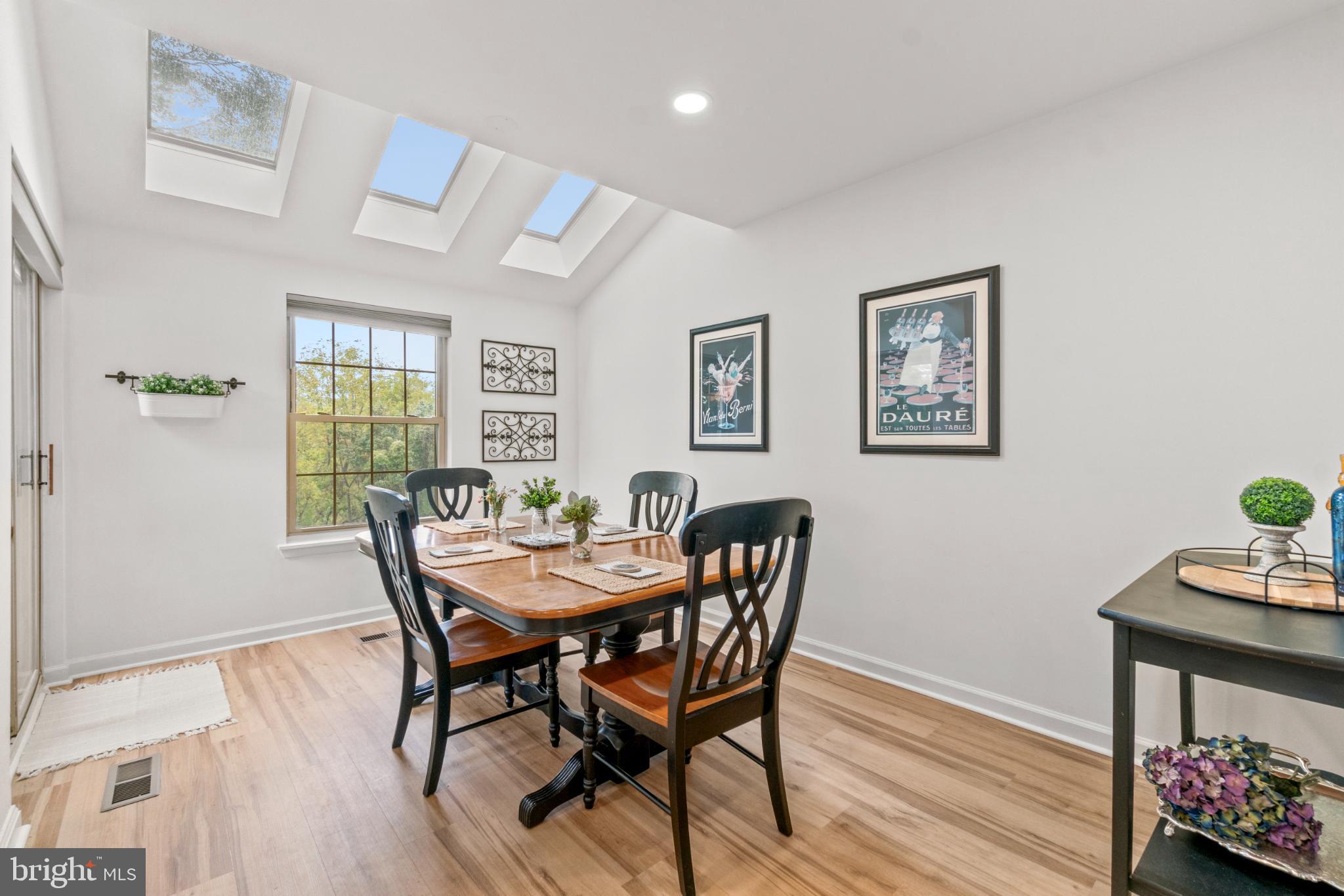 146 English Run Circle Sparks, MD 21152 - Photo 10 of 37 Bright dining area with skylights and art.