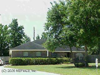 3025 Nautilus Road Middleburg, FL 32068 - Photo 1 of 1 a view of a house with a yard and potted plants