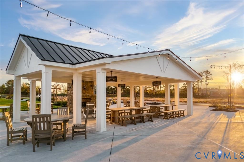 2616 Calgary Drive Chester, VA 23831 - Photo 12 of 14 a patio area with table and chairs