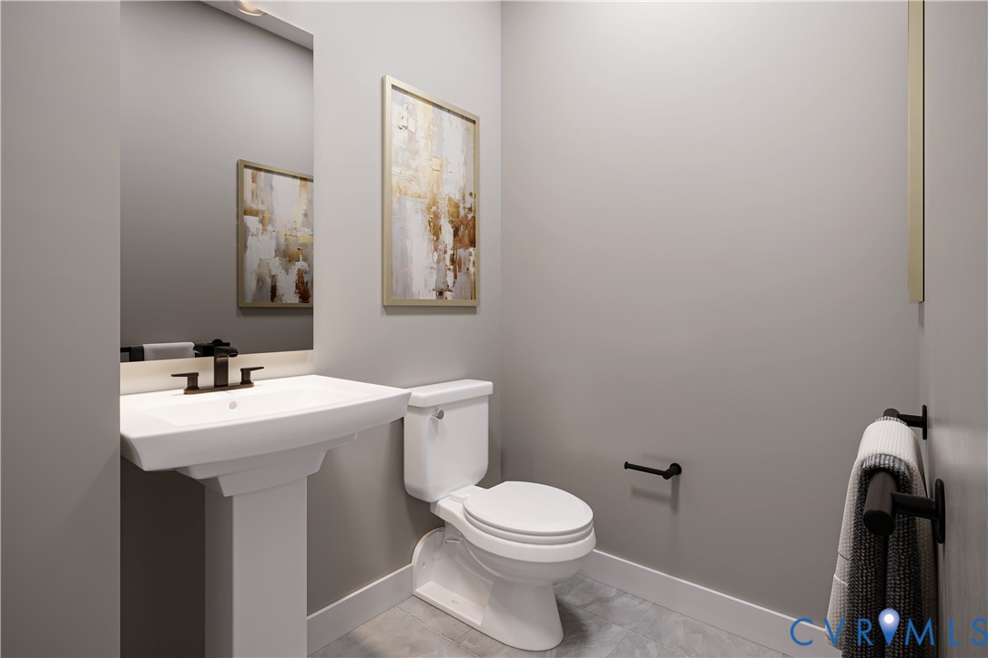 2616 Calgary Drive Chester, VA 23831 - Photo 5 of 14 a bathroom with a sink a toilet and mirror