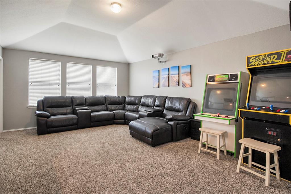 130 Cherrytree Trail Forney, TX 75126 - Photo 13 of 31 a living room with furniture and a flat screen tv