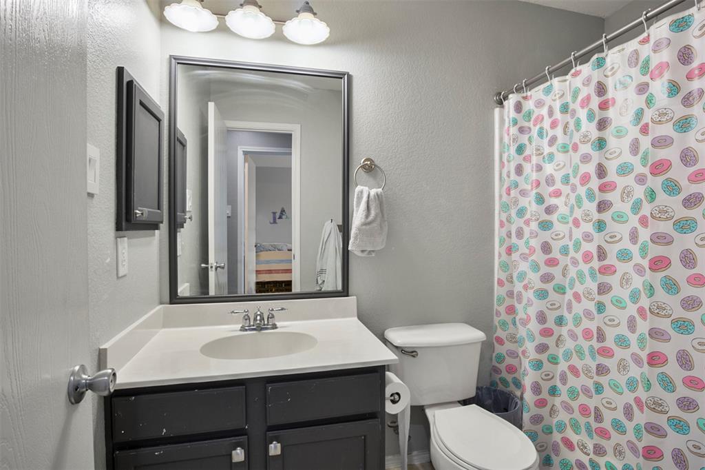 130 Cherrytree Trail Forney, TX 75126 - Photo 18 of 31 a bathroom with a sink and a mirror