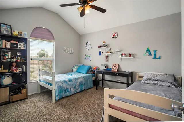 a bedroom with bed and a window