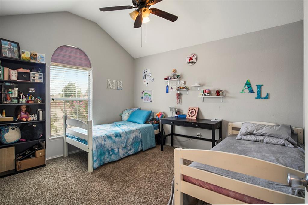 130 Cherrytree Trail Forney, TX 75126 - Photo 19 of 31 a bedroom with bed and a window