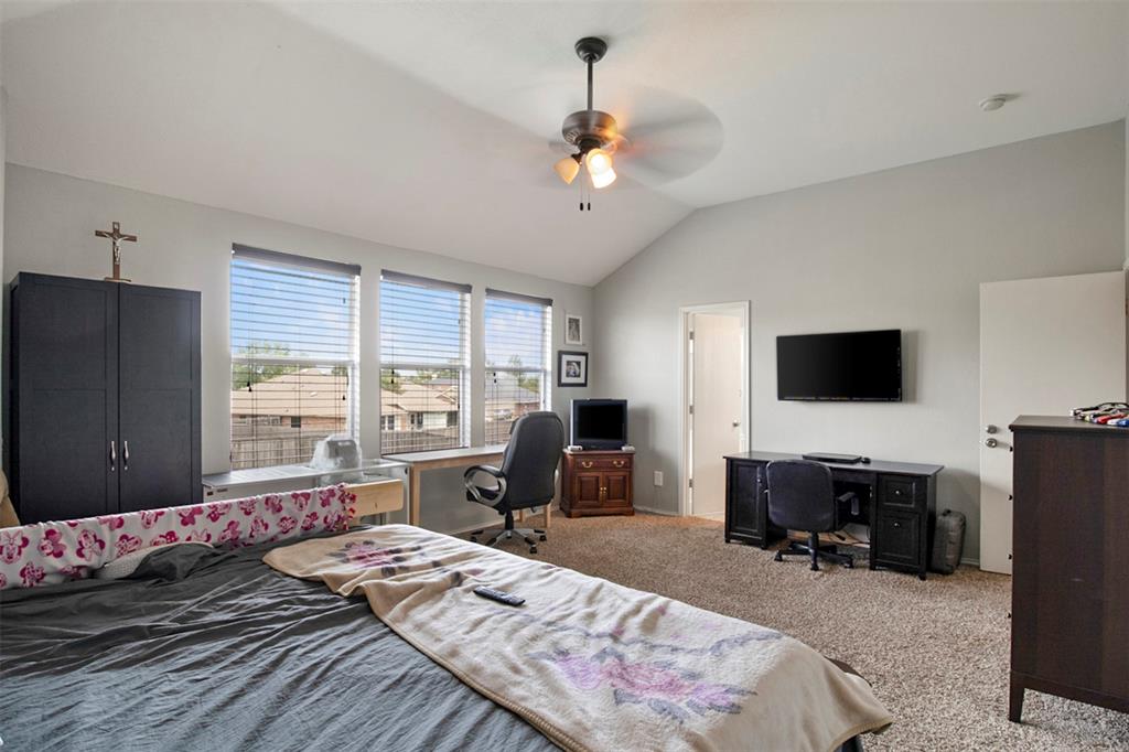 130 Cherrytree Trail Forney, TX 75126 - Photo 23 of 31 a bedroom with a bed a couch and large window