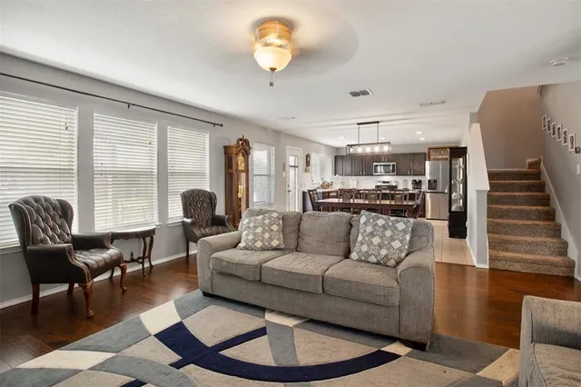 a living room with furniture and a large window