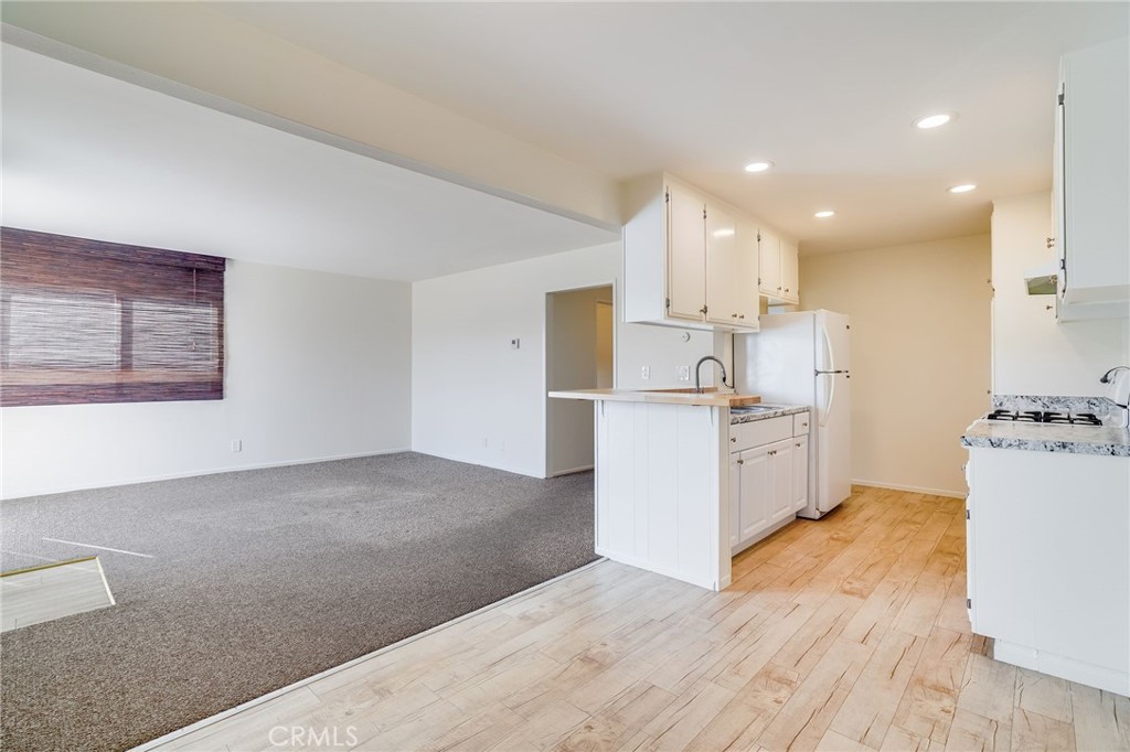 705 Iris Avenue Corona del Mar, CA 92625 - Photo 25 of 36 a view of kitchen with wooden floor