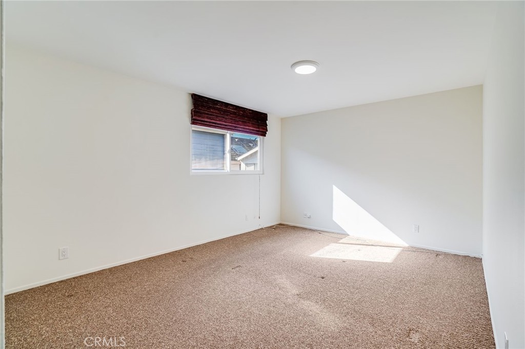705 Iris Avenue Corona del Mar, CA 92625 - Photo 31 of 36 a view of an empty room with a window