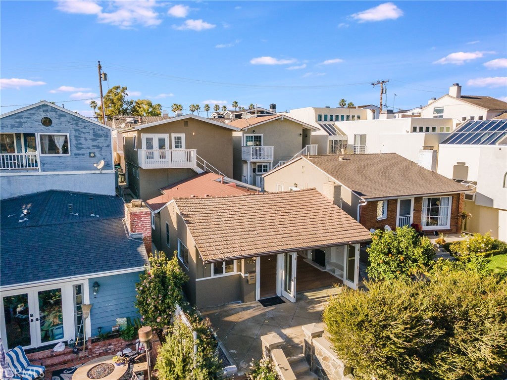 705 Iris Avenue Corona del Mar, CA 92625 - Photo 6 of 36 a aerial view of a house with a yard and potted plants