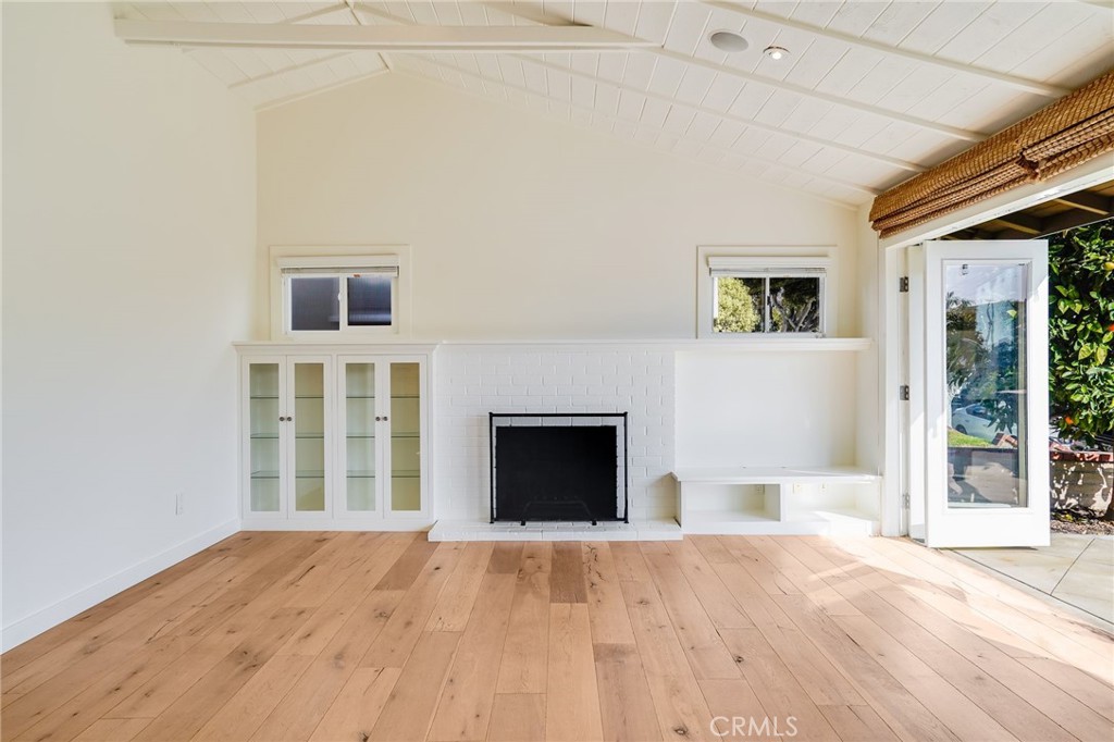 705 Iris Avenue Corona del Mar, CA 92625 - Photo 10 of 36 a view of an empty room with window and fire place