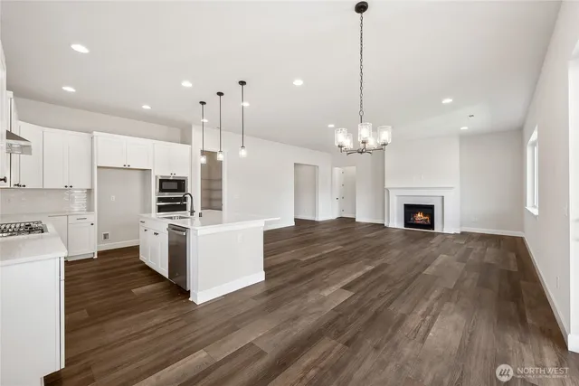 a view of a kitchen with a sink and microwave