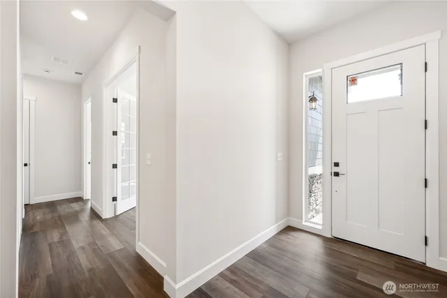 wooden floor with white walls