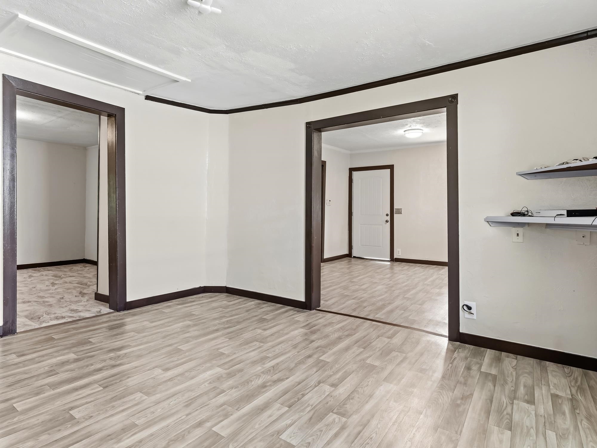 737 9th Street Port Arthur, TX 77640 - Photo 9 of 20 a view of a room with wooden floor and a bathroom