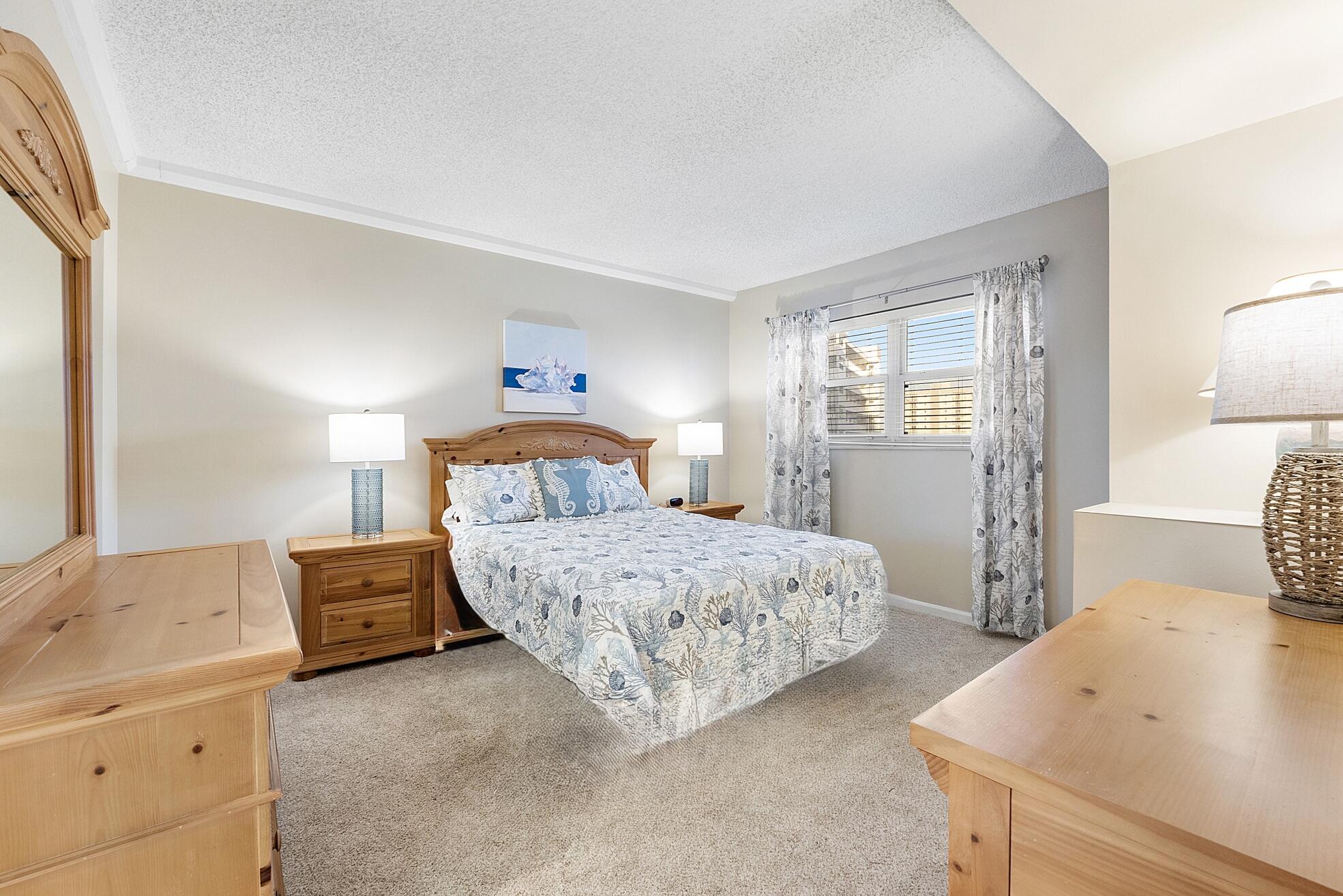 3310 South Ocean Boulevard, Unit 629D Highland Beach, FL 33487 - Photo 13 of 35 a bedroom with a bed and wooden floor