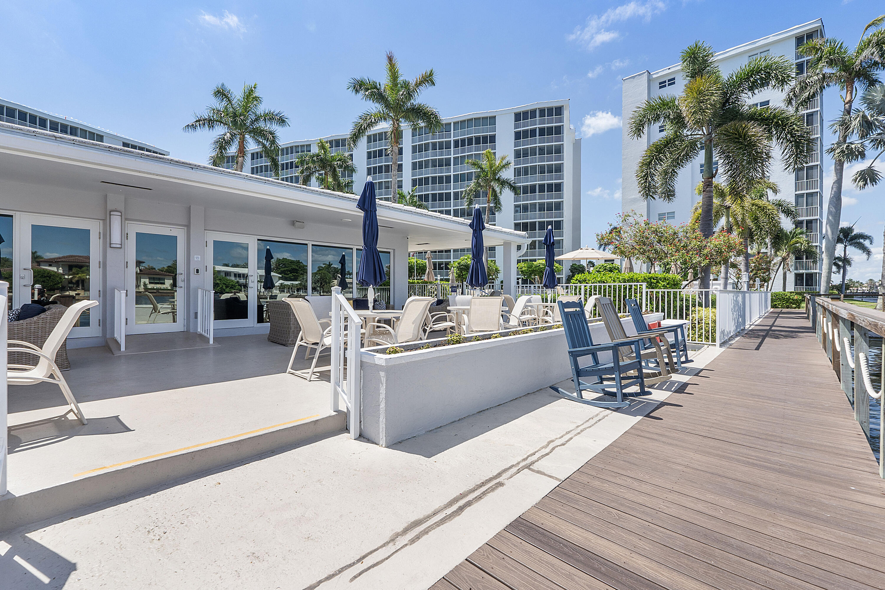 3310 South Ocean Boulevard, Unit 629D Highland Beach, FL 33487 - Photo 18 of 35 a view of a swimming pool with chairs in patio