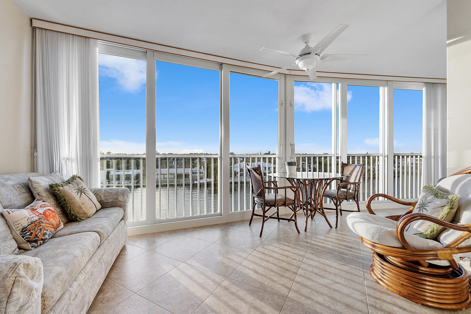 3310 South Ocean Boulevard, Unit 629D Highland Beach, FL 33487 - Photo 2 of 35 a living room with furniture and a floor to ceiling window