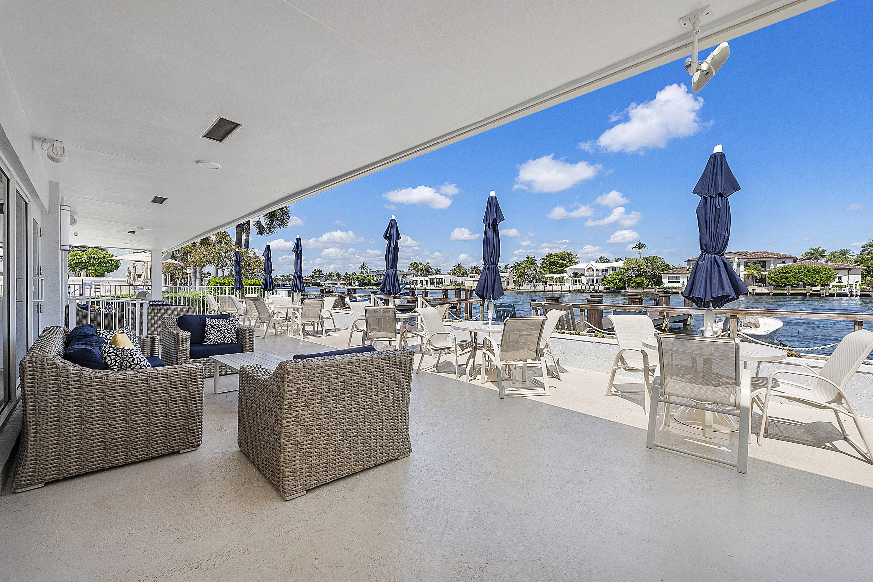3310 South Ocean Boulevard, Unit 629D Highland Beach, FL 33487 - Photo 22 of 35 a living room with couches and a view of kitchen with dining table
