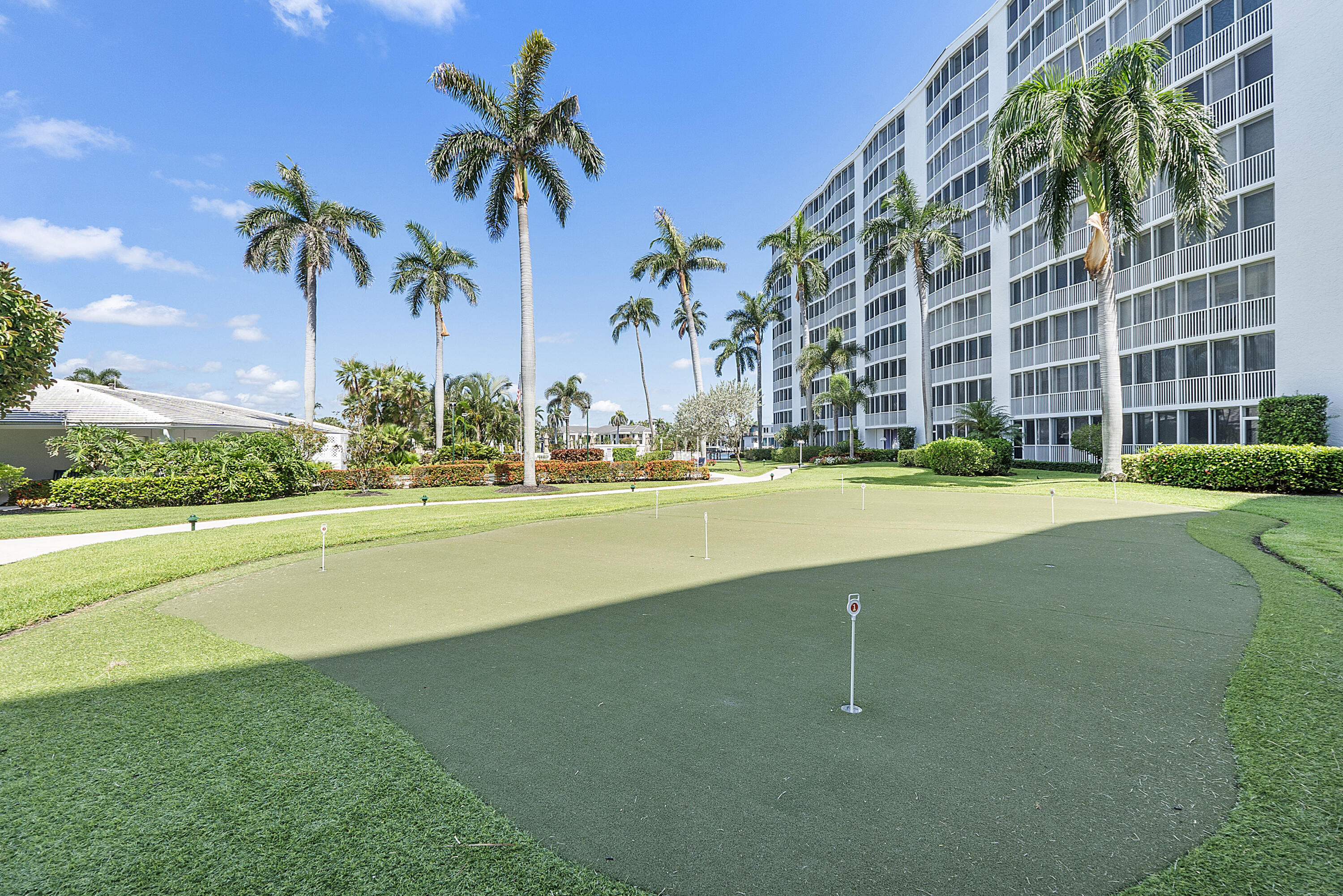 3310 South Ocean Boulevard, Unit 629D Highland Beach, FL 33487 - Photo 32 of 35 a swimming pool with outdoor seating and yard