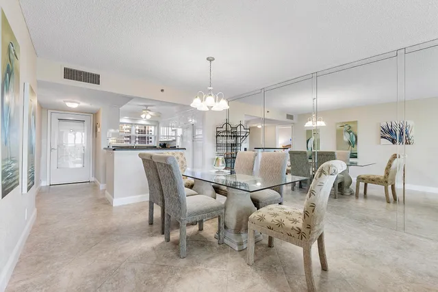 a large kitchen with a table and chairs