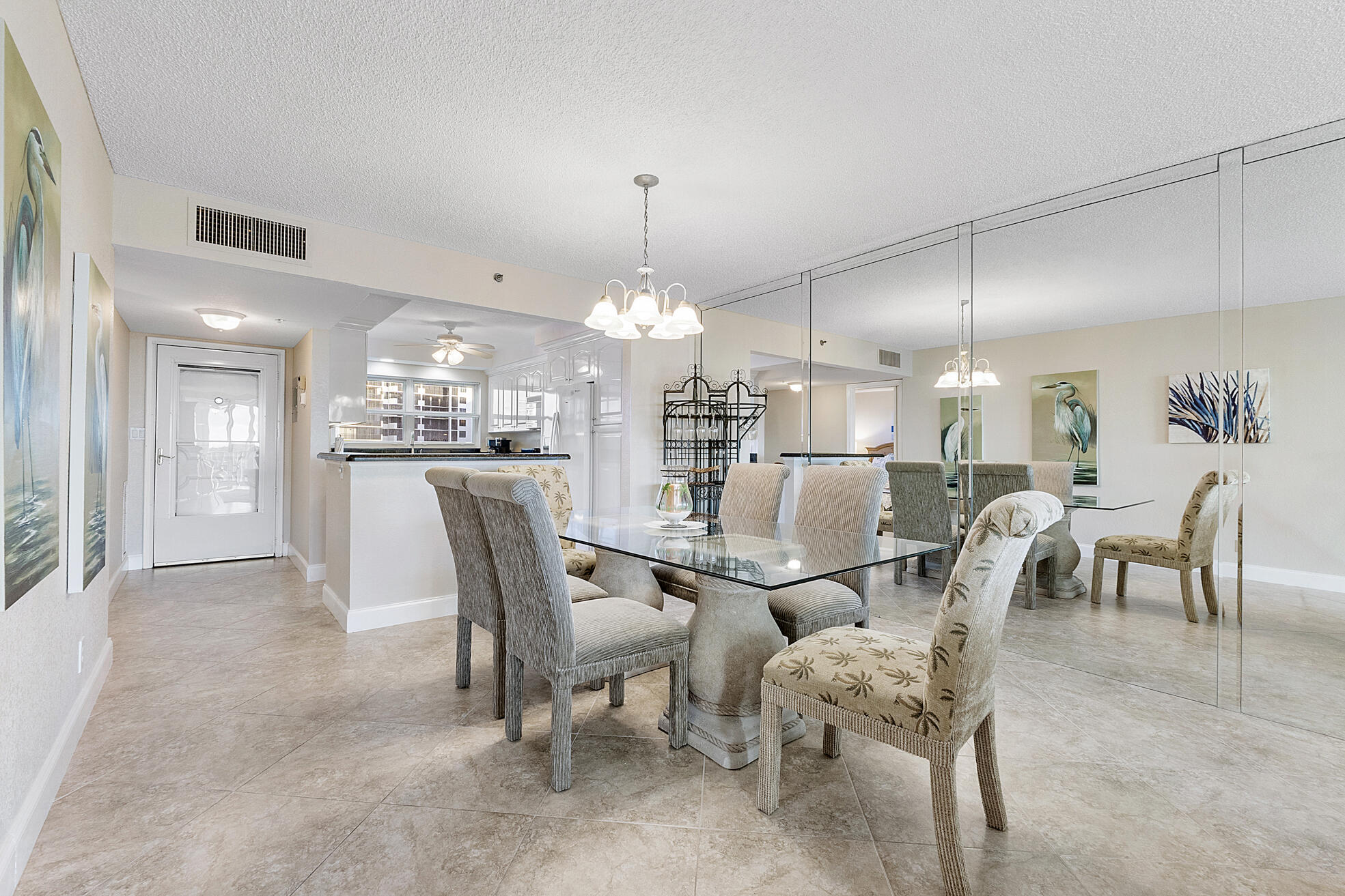 3310 South Ocean Boulevard, Unit 629D Highland Beach, FL 33487 - Photo 8 of 35 a large kitchen with a table and chairs
